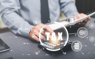 Businessman is handling paperwork and calculating tax rates and business finance budget ,Effective tax deduction planning ideas for individuals and companies,Document Management System
